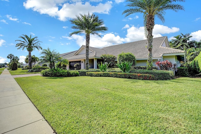 single story home featuring a front yard