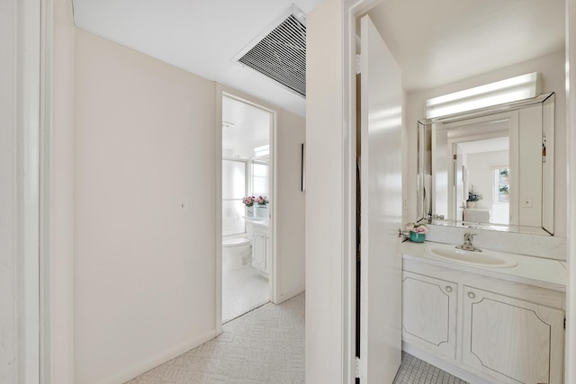 bathroom featuring vanity and toilet