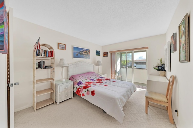 carpeted bedroom with a textured ceiling