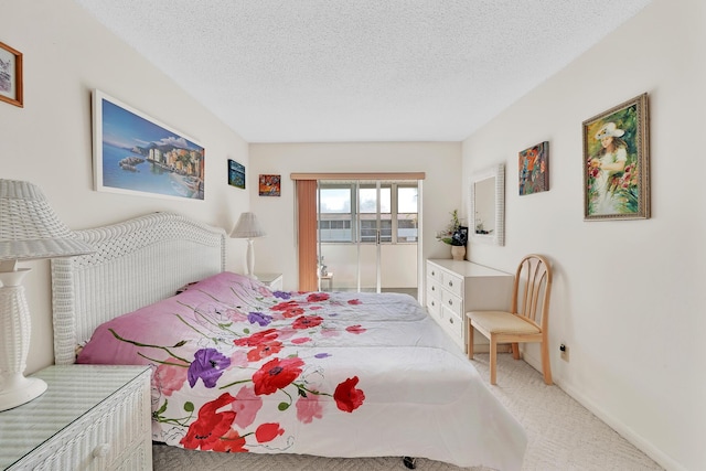 bedroom with carpet and a textured ceiling