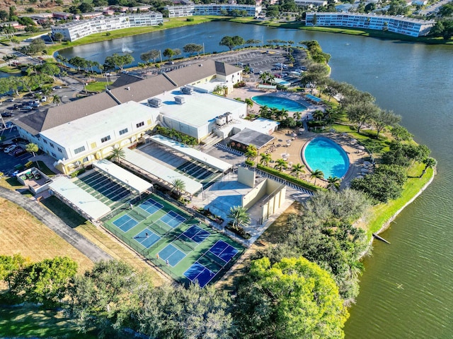 birds eye view of property with a water view