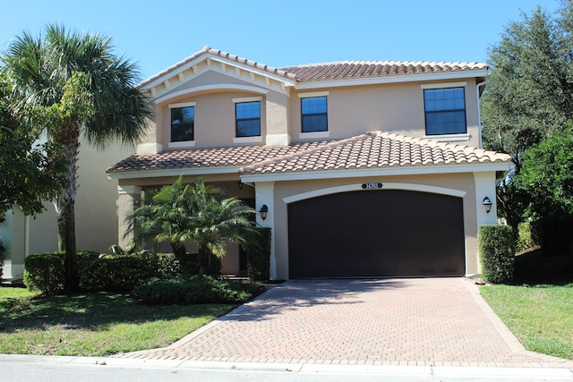 mediterranean / spanish-style house featuring a garage