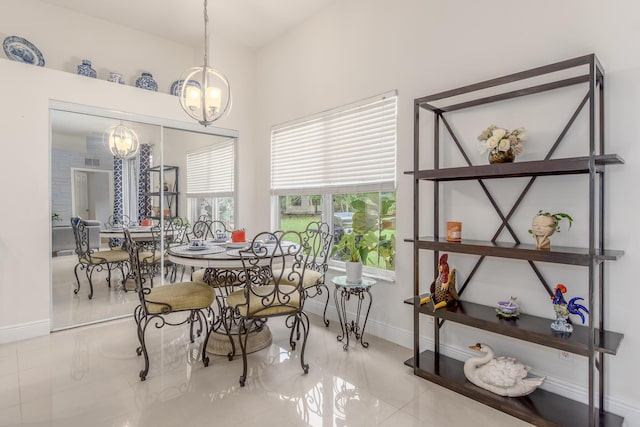 308 SW Egret Lndg, Port Saint Lucie, FL 34953 - dining room featuring a chandelier, baseboards, and tile patterned flooring