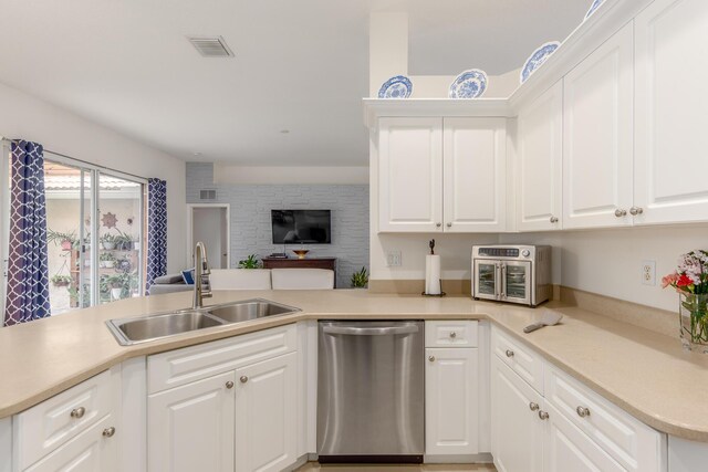 308 SW Egret Lndg, Port Saint Lucie, FL 34953 - kitchen with stainless steel dishwasher, a sink, and light countertops