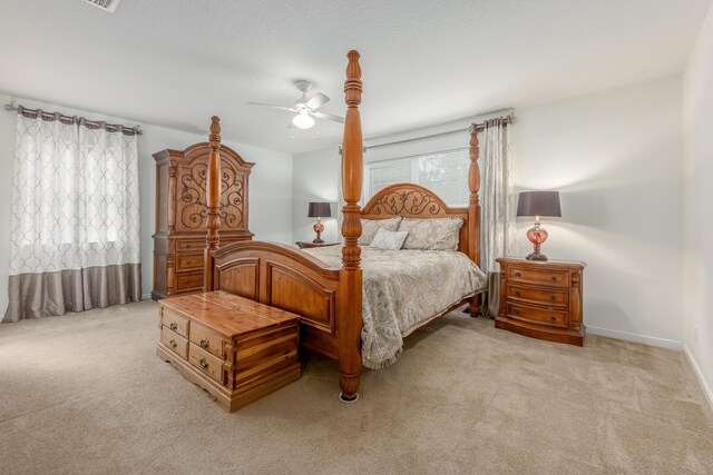 308 SW Egret Lndg, Port Saint Lucie, FL 34953 - bedroom with light colored carpet, a ceiling fan, and baseboards