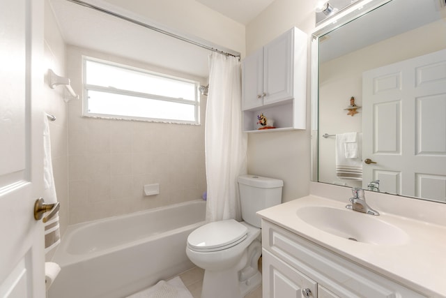 full bathroom featuring shower / bath combo with shower curtain, tile patterned floors, vanity, and toilet