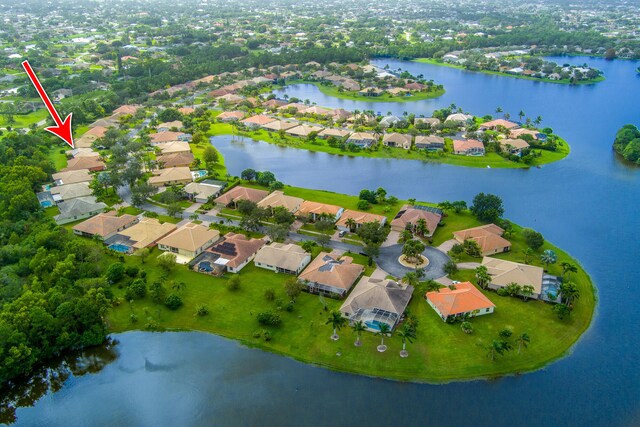 birds eye view of property featuring a water view