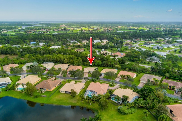 308 SW Egret Lndg, Port Saint Lucie, FL 34953 - aerial view of property and surrounding area with nearby suburban area and a large body of water
