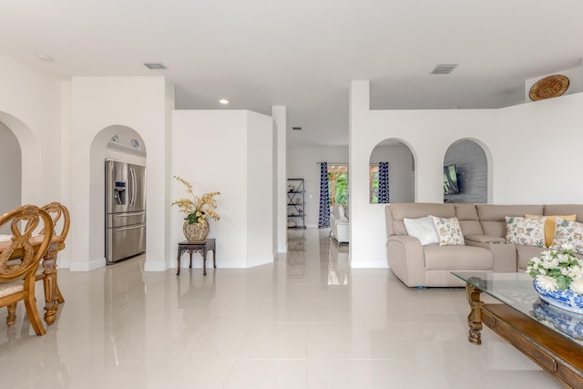 living room with light tile patterned floors