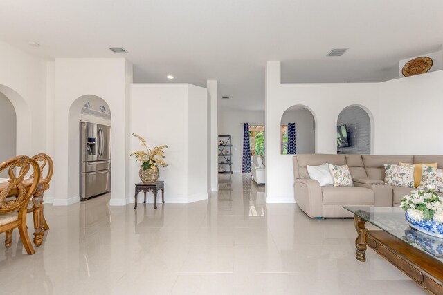 308 SW Egret Lndg, Port Saint Lucie, FL 34953 - living room with light tile patterned floors, recessed lighting, and baseboards