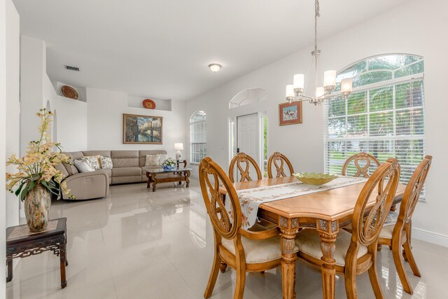 308 SW Egret Lndg, Port Saint Lucie, FL 34953 - dining area featuring a chandelier, plenty of natural light, and light tile patterned floors