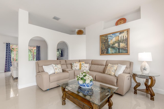308 SW Egret Lndg, Port Saint Lucie, FL 34953 - living room featuring baseboards and light tile patterned floors