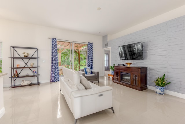 tiled living room with a fireplace