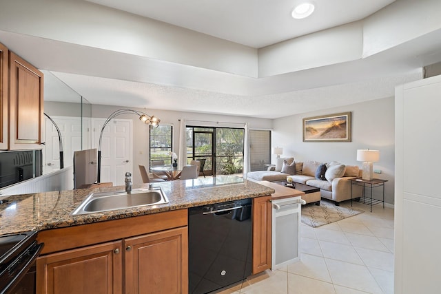 kitchen featuring sink, dark stone countertops, a textured ceiling, light tile patterned floors, and black appliances