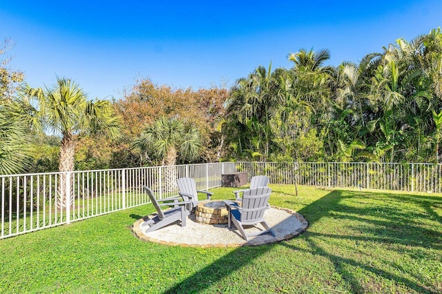 view of yard featuring a fire pit and a patio area