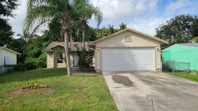 ranch-style house with a garage and a front lawn