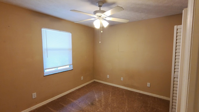 unfurnished room featuring carpet flooring, a textured ceiling, and ceiling fan