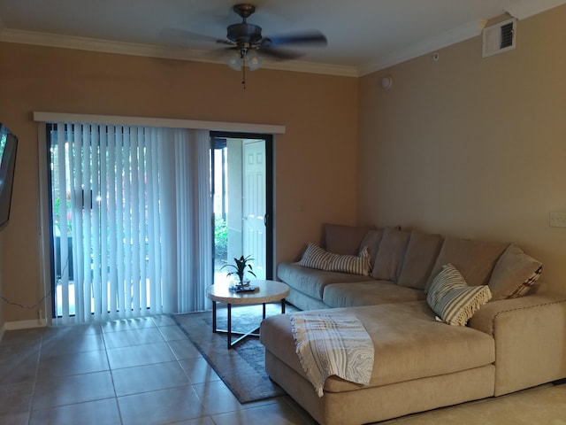 tiled living room with ceiling fan and crown molding