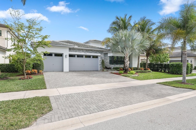 view of front facade featuring a garage and a front lawn