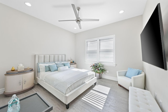 bedroom featuring ceiling fan and light hardwood / wood-style floors