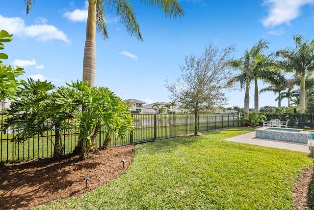 view of yard featuring a fenced in pool and a patio area