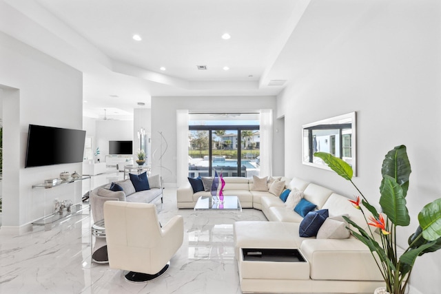 living room with a tray ceiling