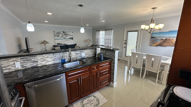 kitchen with hanging light fixtures, dishwasher, sink, and tasteful backsplash