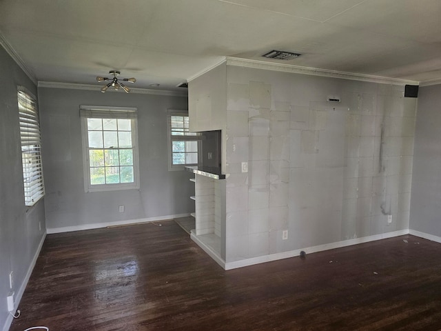 unfurnished room featuring dark hardwood / wood-style floors, crown molding, and ceiling fan