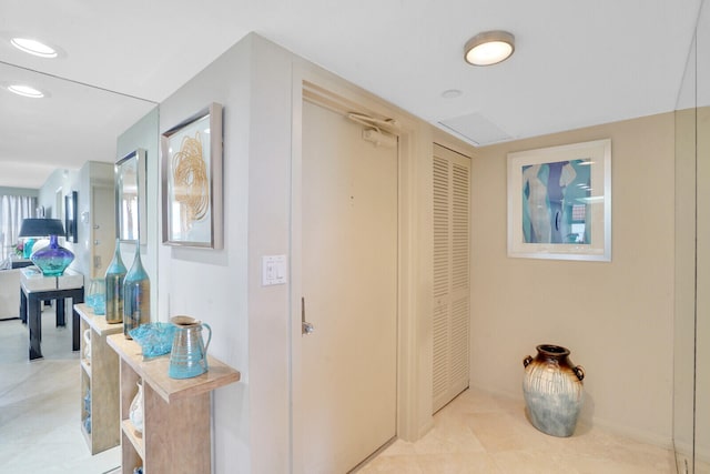 hallway featuring light tile patterned floors