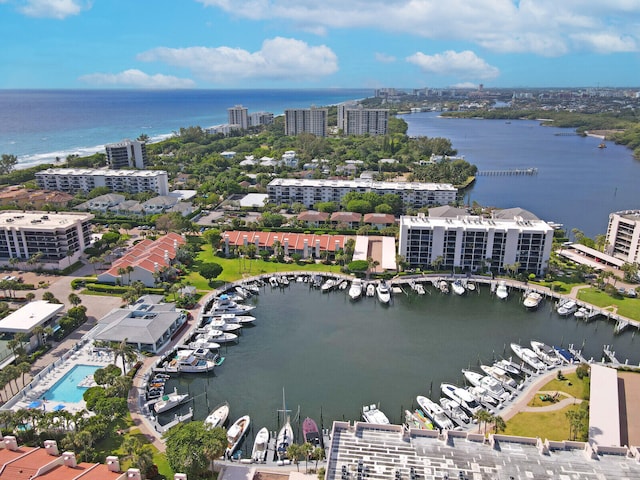 birds eye view of property with a water view