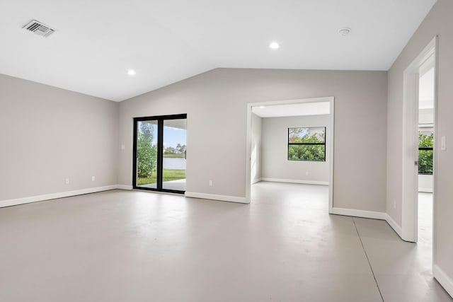 15093 Aguila Ave, Fort Pierce, FL 34951 - spare room featuring a healthy amount of sunlight and lofted ceiling