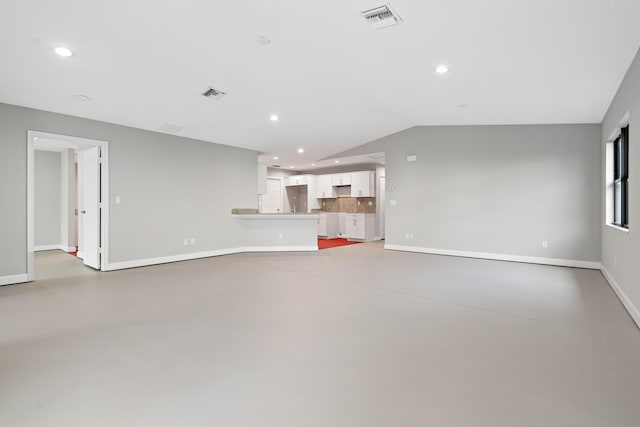 15093 Aguila Ave, Fort Pierce, FL 34951 - unfurnished living room with concrete flooring and vaulted ceiling