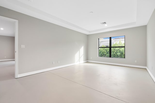 15093 Aguila Ave, Fort Pierce, FL 34951 - spare room with concrete floors and a tray ceiling