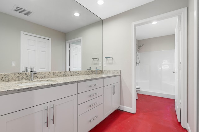 15093 Aguila Ave, Fort Pierce, FL 34951 - bathroom featuring toilet, a shower, and vanity