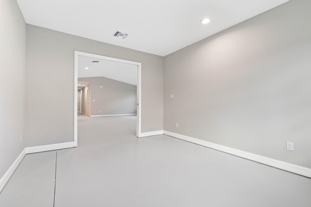 15093 Aguila Ave, Fort Pierce, FL 34951 - unfurnished room with lofted ceiling and concrete floors