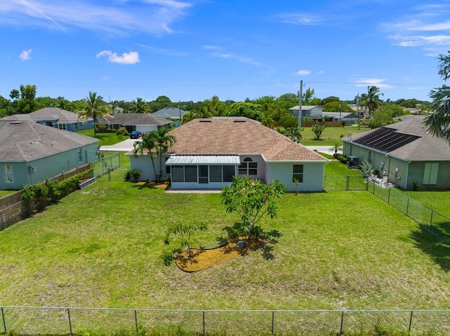 rear view of house with a yard