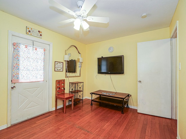 foyer entrance with ceiling fan and hardwood / wood-style flooring