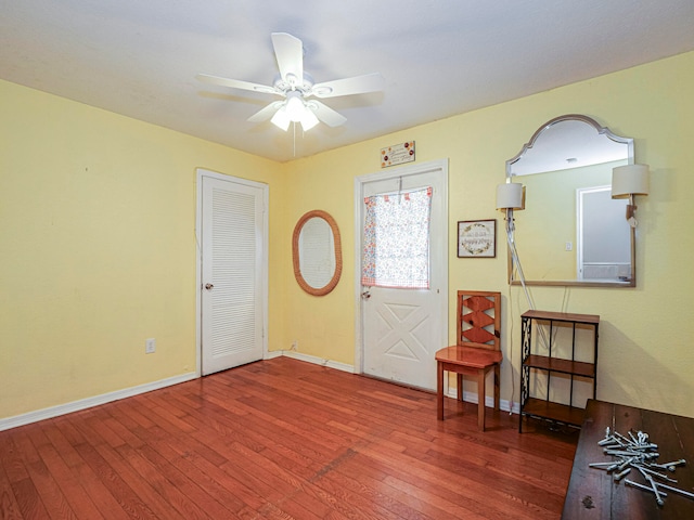 foyer entrance featuring dark hardwood / wood-style floors and ceiling fan