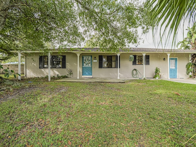 ranch-style house with a front lawn