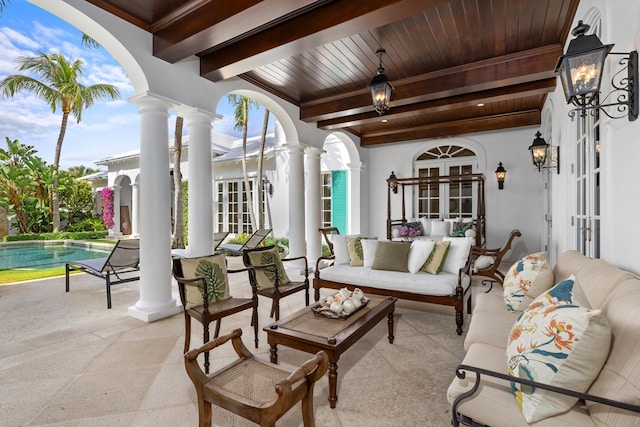 view of patio / terrace with french doors and an outdoor living space