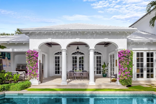 view of patio / terrace with an outdoor pool, an outdoor hangout area, and french doors