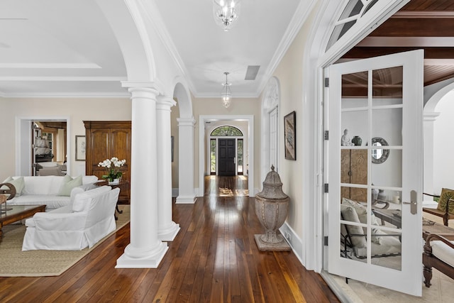 foyer featuring ornamental molding, dark wood-type flooring, and french doors