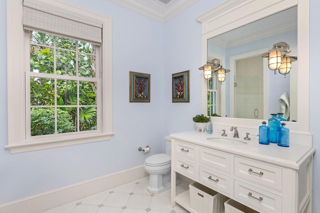 bathroom with toilet, vanity, baseboards, ornamental molding, and a shower stall