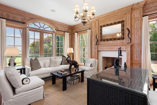 living room with a chandelier and wooden walls