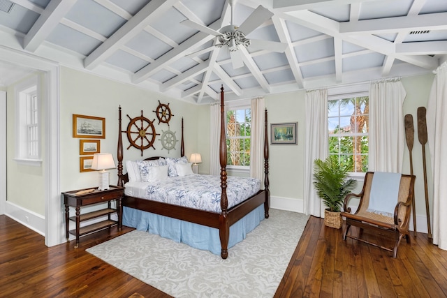 bedroom with hardwood / wood-style flooring, baseboards, coffered ceiling, and beamed ceiling