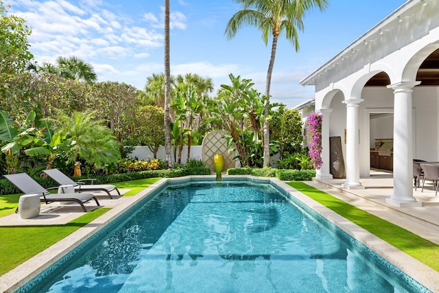 view of swimming pool with a patio area