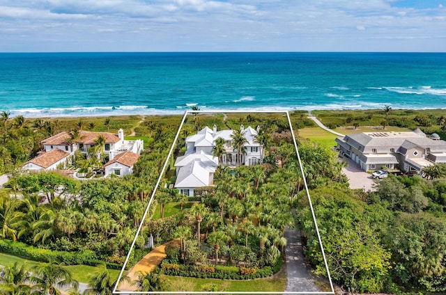 bird's eye view with a water view and a view of the beach