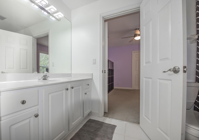 bathroom featuring tile patterned floors, ceiling fan, toilet, and vanity