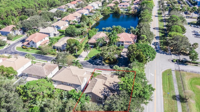 birds eye view of property featuring a water view