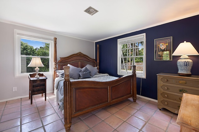 tiled bedroom featuring ornamental molding